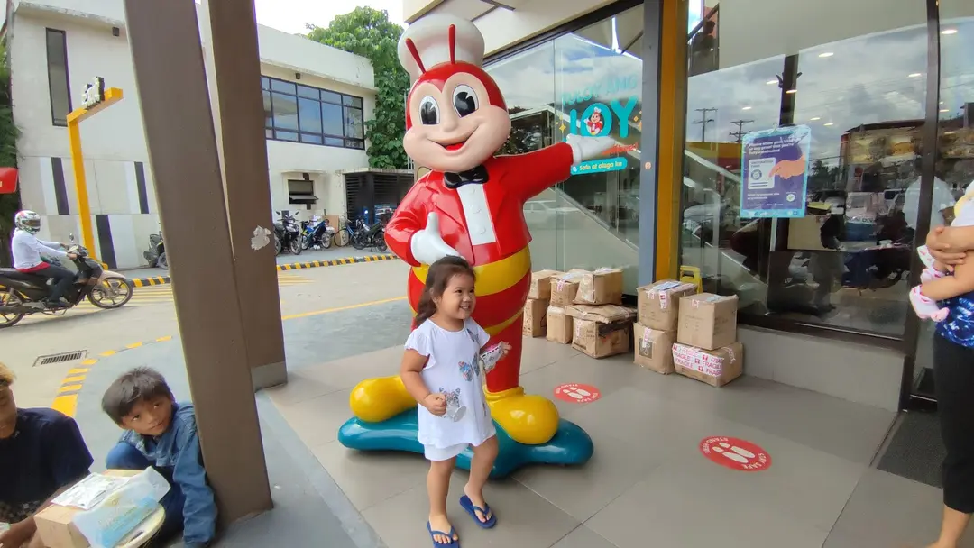 Child Posing with Jollibee